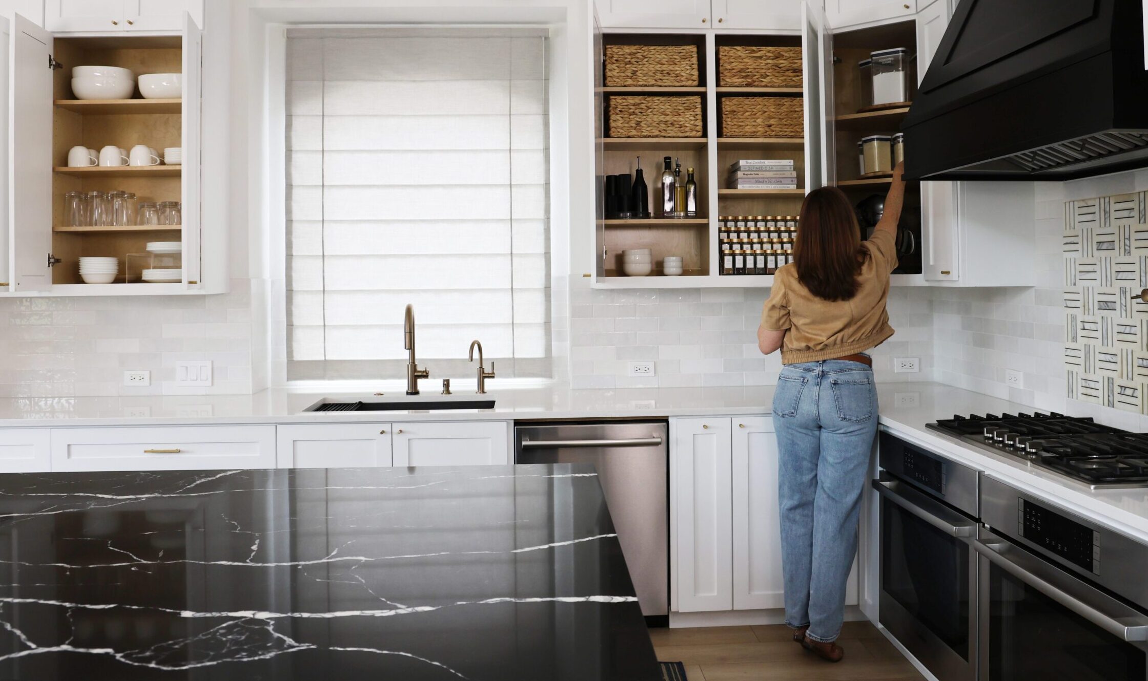 Professionally organized kitchen with functional cabinet storage systems